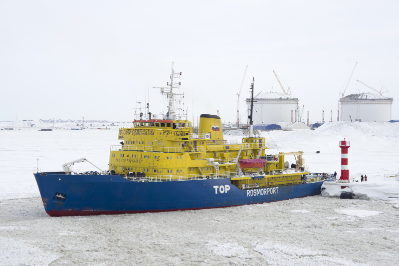 A Russian icebreaker escorts a vessel through ice near the Arctic port of Sabetta on Russia's Northern Sea Route