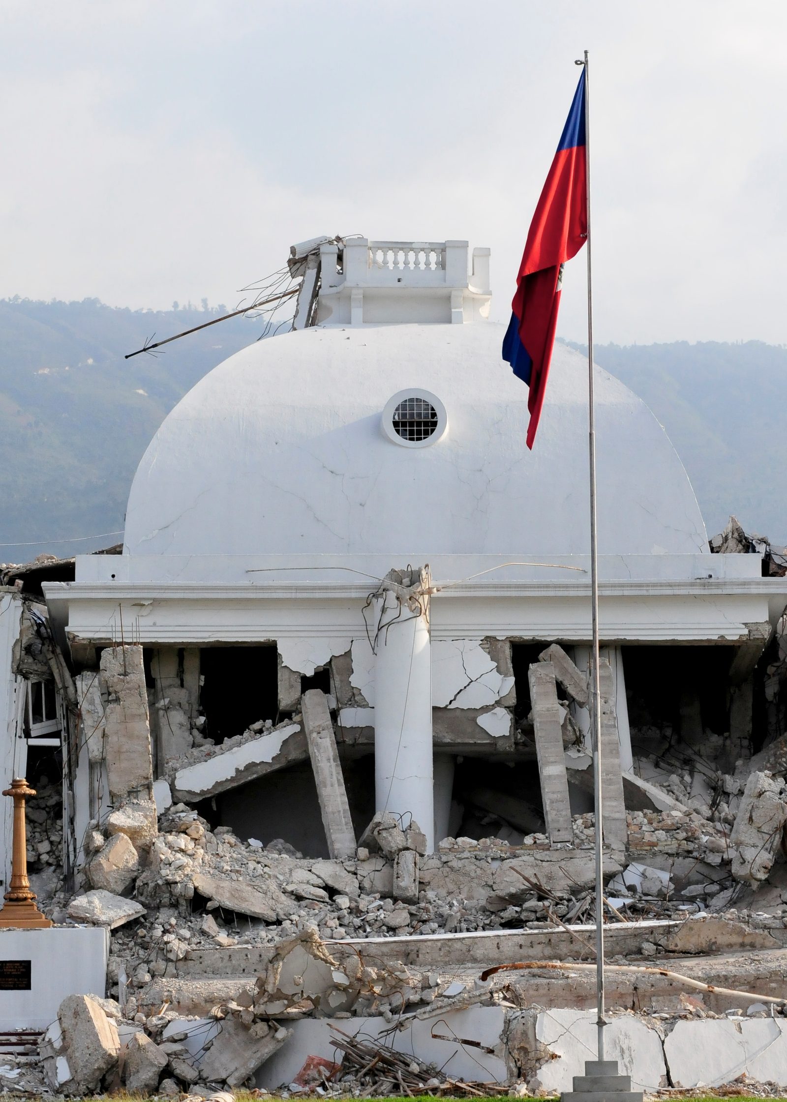 The Haitian flag flying in front of the National Palace in Port-au-Prince
