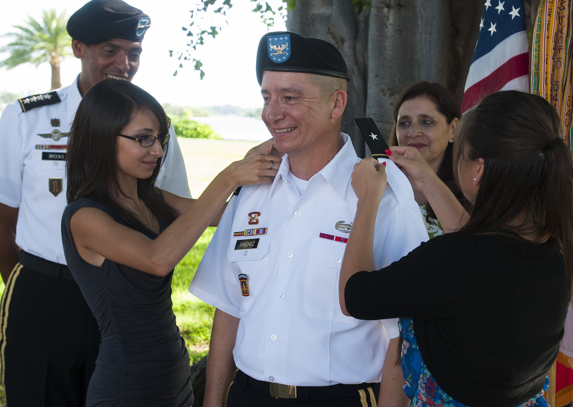 A US Army officer receives the one-star insignia of a brigadier general