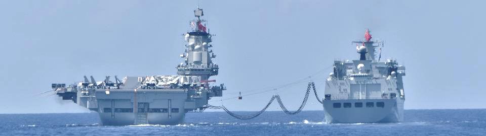 Chinese aircraft carrier Liaoning sailing alongside a Type 901 fast combat support ship, photographed by Japan's Ministry of Defense