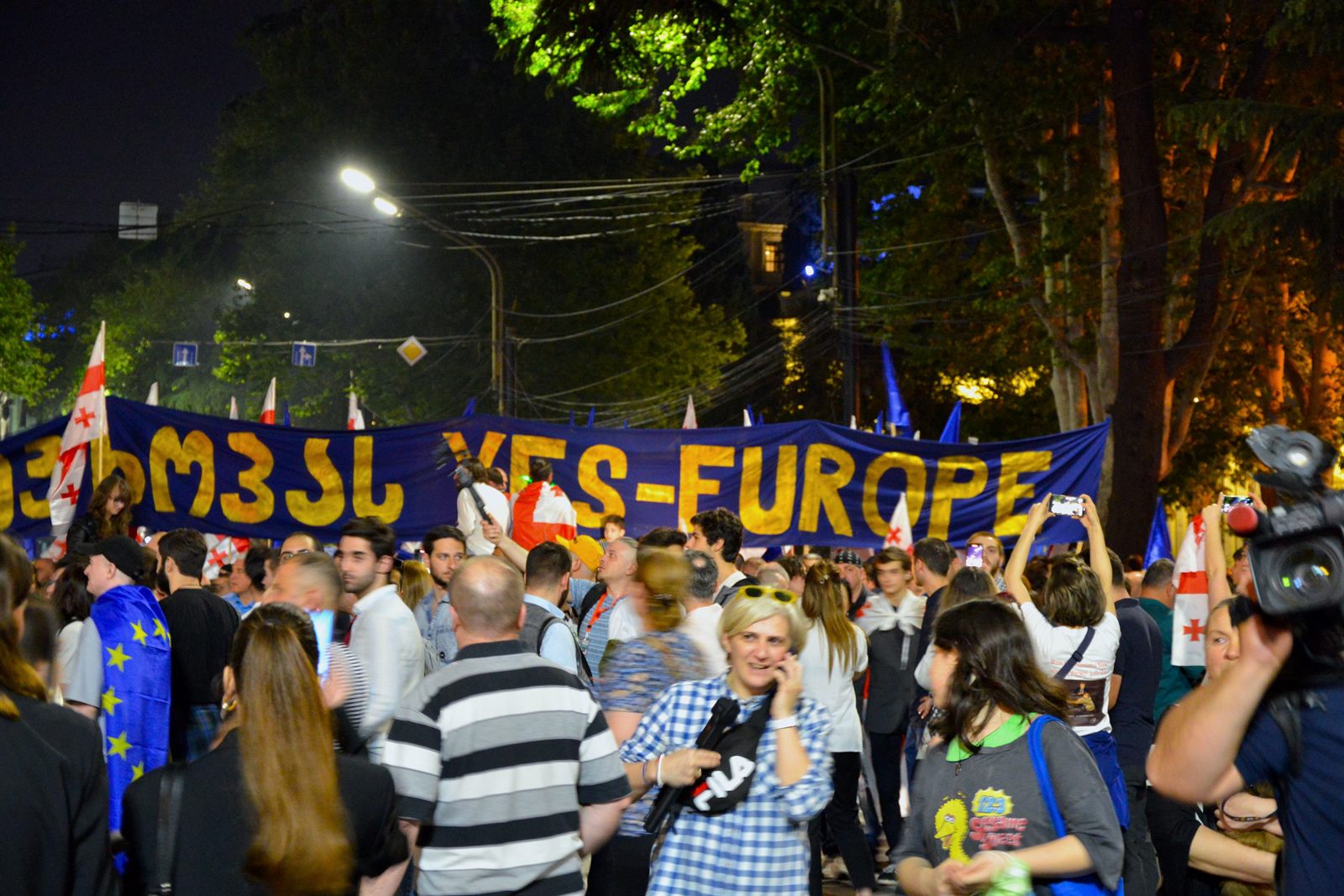 Protesters in Tbilisi holding EU flags at a demonstration against Georgia's 'foreign agents' law, 28 April 2024