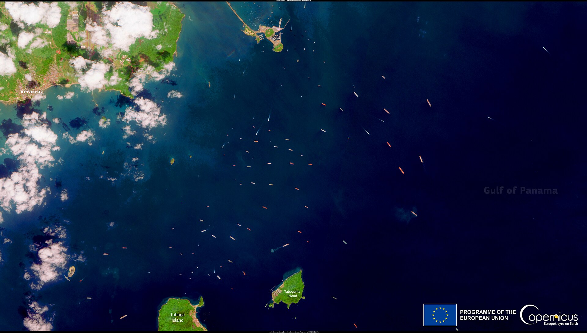 Copernicus Sentinel-2 satellite image showing dozens of ships anchored in the Gulf of Panama waiting to transit the canal