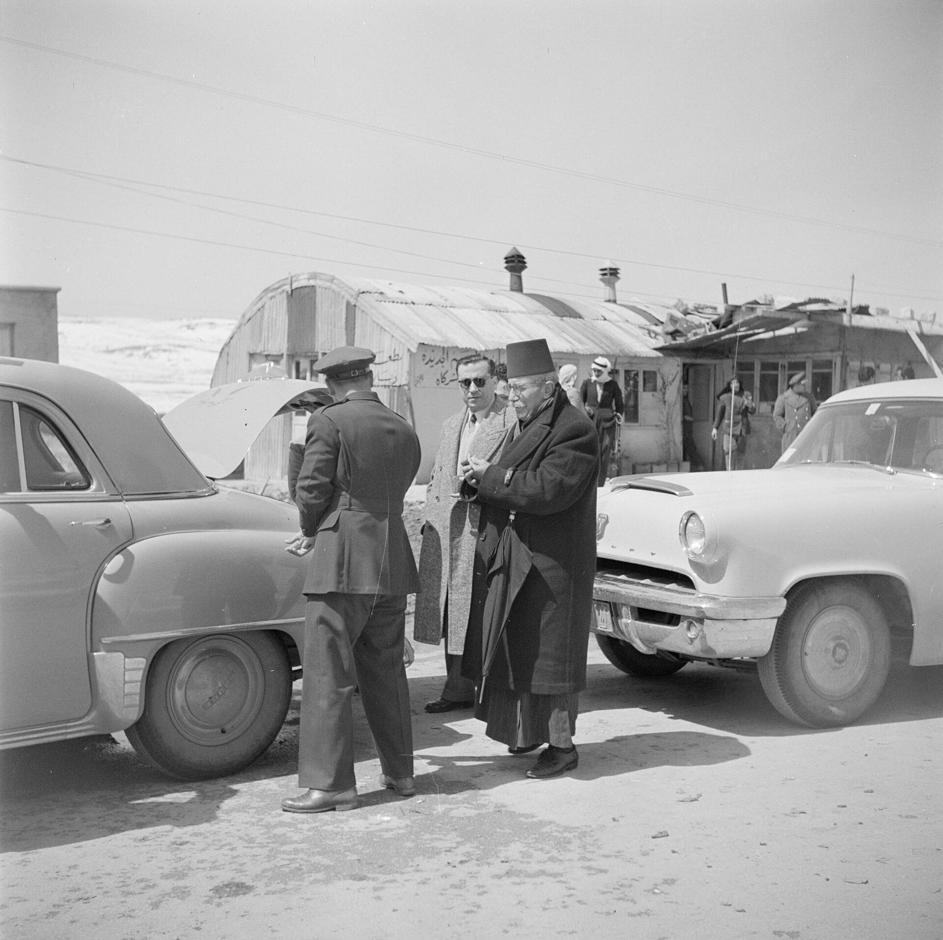 Officials and travellers at a border crossing point between Lebanon and Syria in 1950