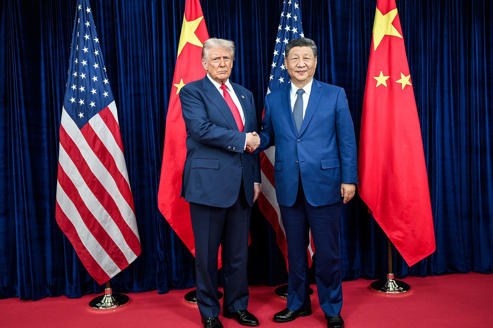 US President Donald Trump greets Chinese President Xi Jinping before their October 2025 bilateral meeting in Busan, South Korea