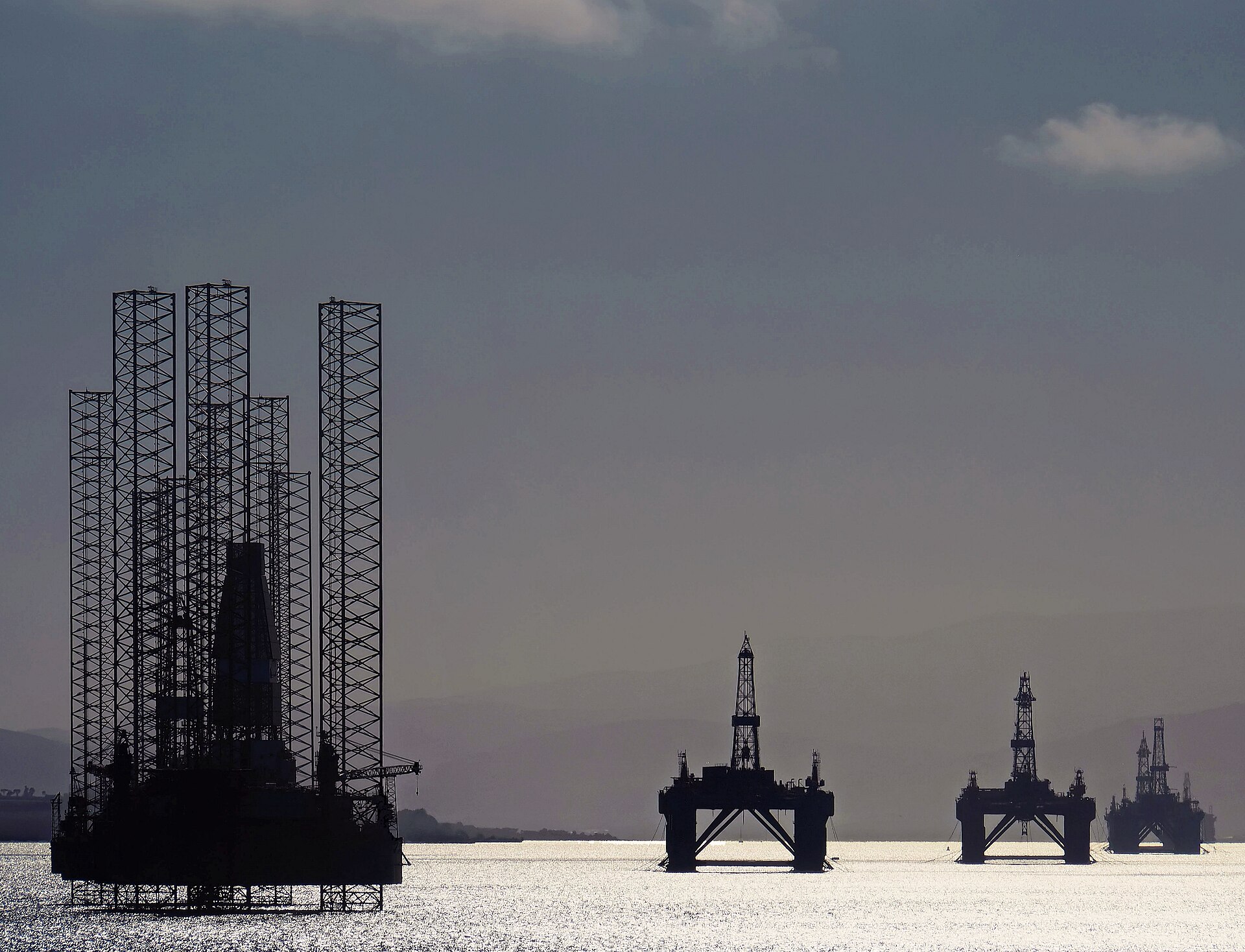 Stacked, decommissioned offshore drilling rigs in the Cromarty Firth near Invergordon, Scotland
