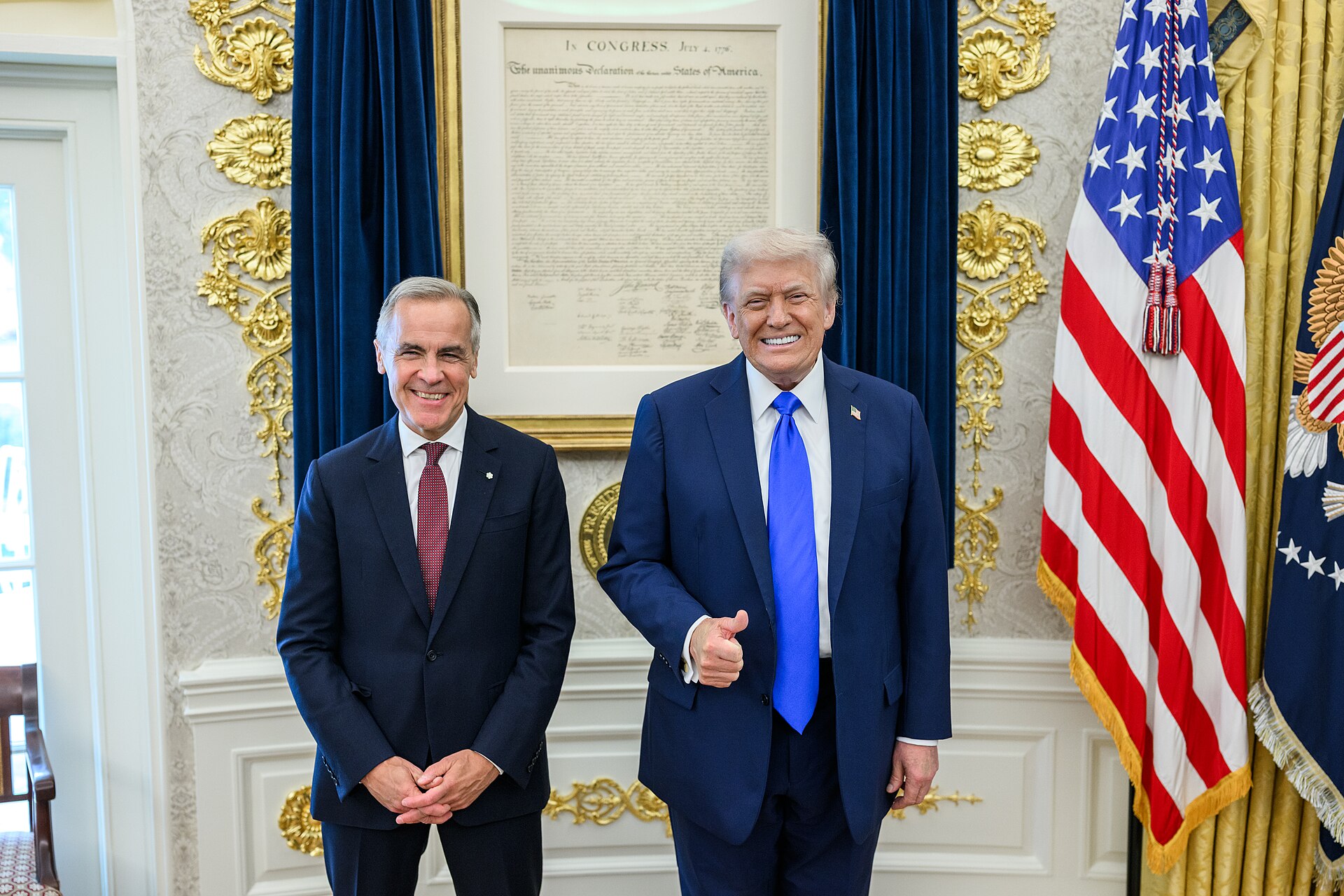 Canadian Prime Minister Mark Carney seated beside US President Donald Trump