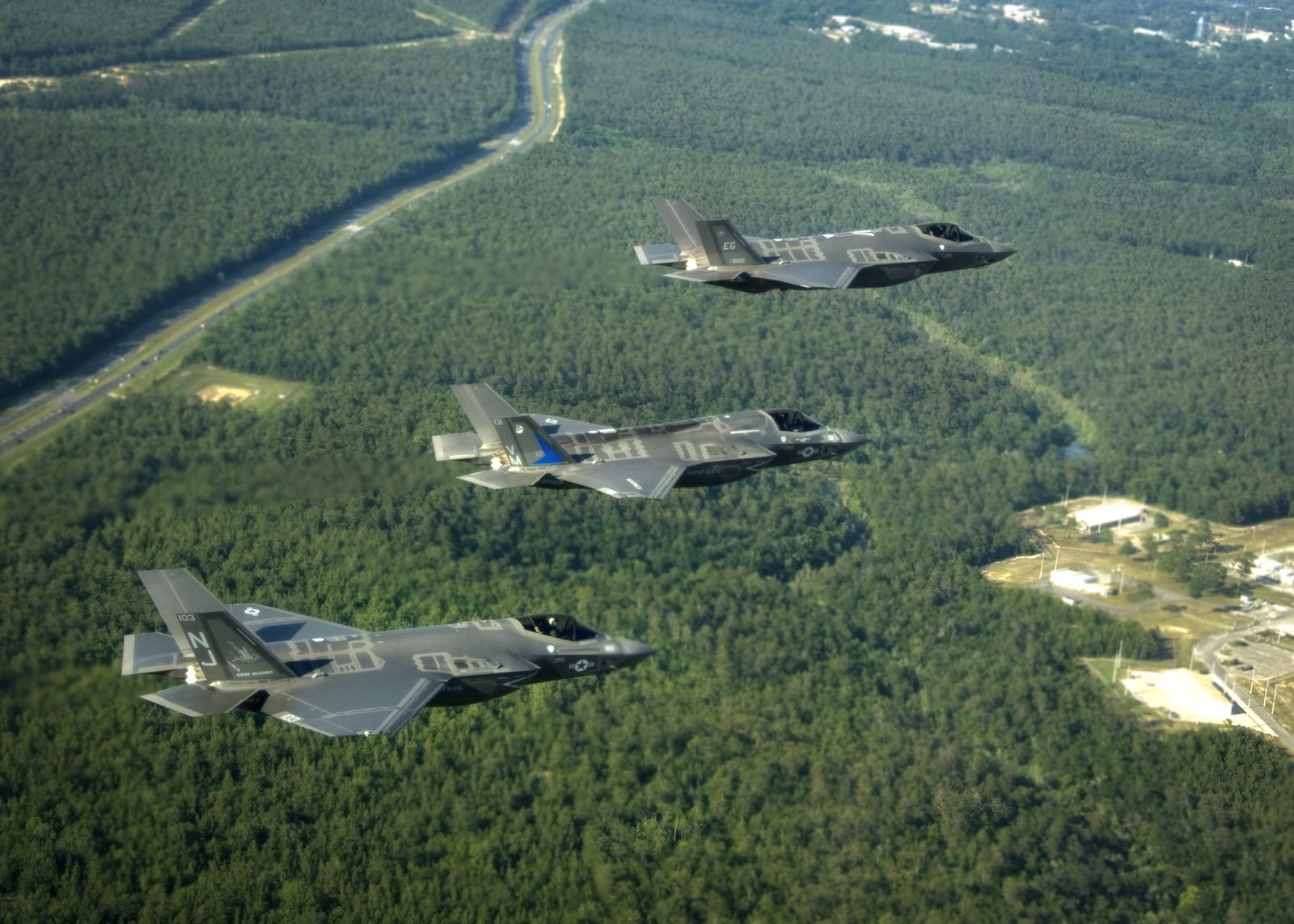 Three F-35 Lightning II variants flying together near Eglin Air Force Base